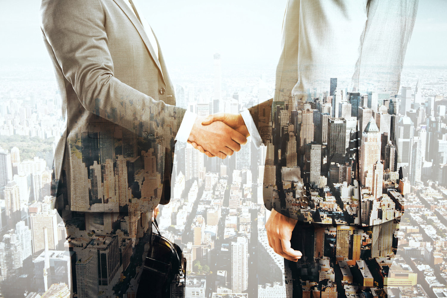 slide show image of 2 people shaking hands superimposed over a city